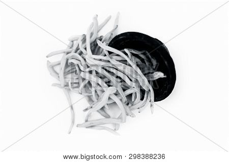 Close Up Of Popular Indian & Asian Ayurvedic Herb Isolated On White In A Clay Bowl I.e. Musli Or Saf