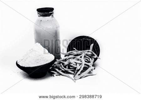 Popular Indian & Asian Ayurvedic Herb Isolated On White In A Clay Bowl I.e. Musli Or Safed Musli Or
