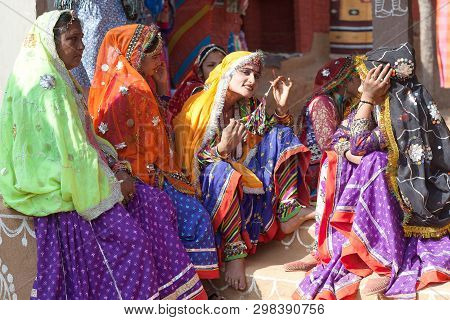 Udaipur, India - January 7, 2019: Indian Rajasthani Women In Traditional Clothes Selling Beads At Lo