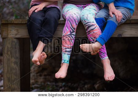 Barefoot Woman With Children.