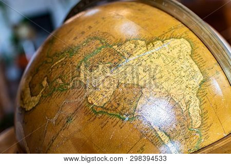 Radun Castle, Czech Republic, 7 April 2019 - Old Globe On Bookshelf Background With Selective Focus 