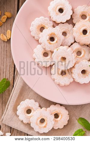 Canestrelli Biscuits With Mint On Wooden Table.