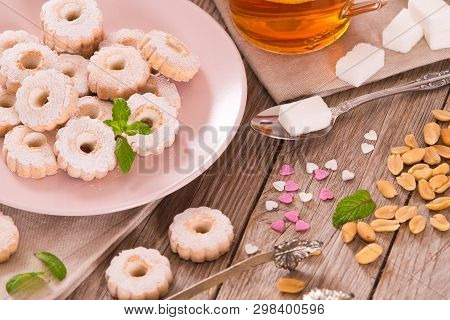 Canestrelli Biscuits With Mint On Wooden Table.