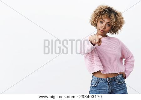 I Am Talking To You. Portrait Of Confident Serious-looking African American Female With Blond Curly 