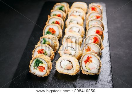 Tempura Maki. Japanese Sushi Rolls Set On Black Slate. Japanese Traditional Fusion Food Style, Resta