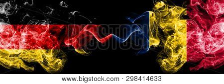 Germany Vs Chad, Chadian Smoky Mystic Flags Placed Side By Side. Thick Colored Silky Smoke Flags Of 