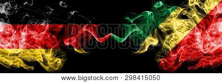 Germany Vs Congo, Congolese Smoky Mystic Flags Placed Side By Side. Thick Colored Silky Smoke Flags 