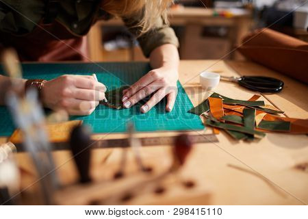Warm Toned Closeup Of Female Artisan Making Leather Bag In Leatherworking Atelier, Copy Space