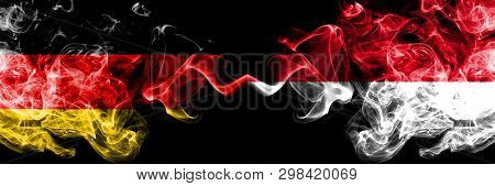 Germany Vs Monaco, Monacan Smoky Mystic Flags Placed Side By Side. Thick Colored Silky Smoke Flags O
