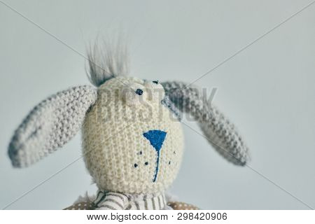 Childrens Toy Plush Rabbit Isolated On A Light Background. Head Of A Rabbit Close Up.