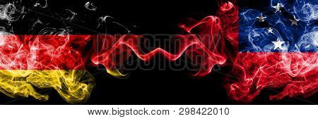 Germany Vs Samoa, Samoan Smoky Mystic Flags Placed Side By Side. Thick Colored Silky Smoke Flags Of 