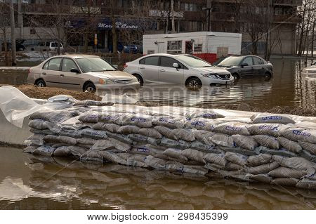 Pierrefonds-roxboro, Quebec, Canada - 29 April 2019: Cars Submerged During Spring Floods