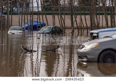 Pierrefonds-roxboro, Quebec, Canada - 29 April 2019: Cars Submerged During Spring Floods