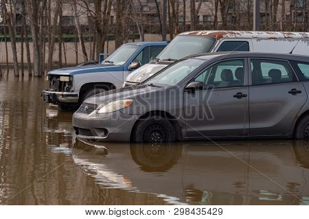 Pierrefonds-roxboro, Quebec, Canada - 29 April 2019: Cars Submerged During Spring Floods