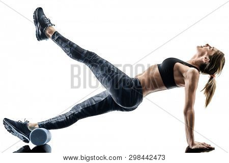 one caucasian woman exercising pilates fitness foam roller exercises isolated  silhouette on white background