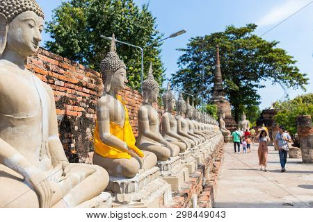 People Visiting The Temple Of Ayutthaya Historical Park On Thailand.