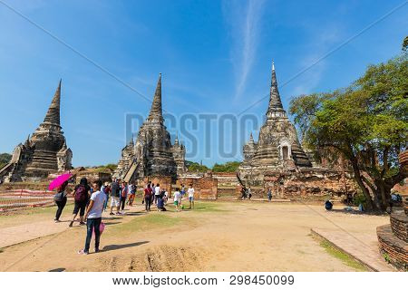 People Visiting The Temple Of Ayutthaya Historical Park On Thailand.