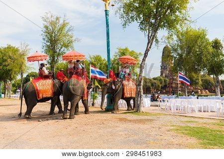 Tourists On An Elephant Ride Tour Of The Ancient City Ayutaya ,thailand..