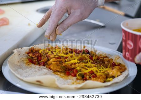 Preparation Of Quesadilla Adding Cheese On Material