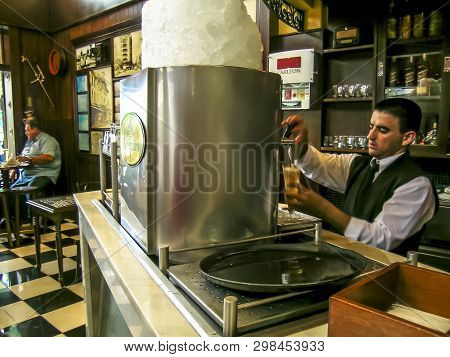 Ribeirao Preto, Sp, Brazil, February 14, 2004. Bartender Pouring From Tap Fresh Beer Into The Glass 