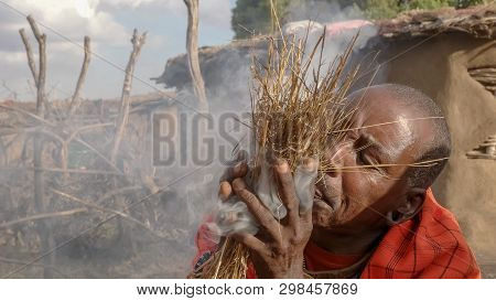A Maasai Warrior Starts A Fire The Traditional Way Without Matches At A Manyatta In Kenya