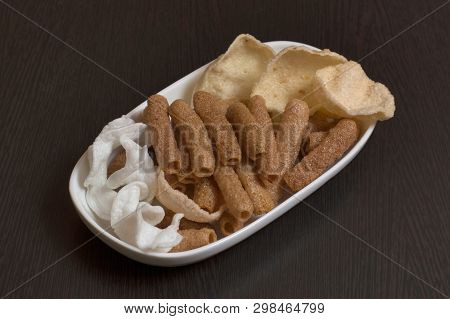 Close-up Of Variety Snacks Plate On Wooden Table.