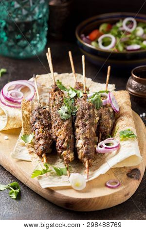 Lula Kebab From Minced Meat (beef, Lamb, Veal) On Pita Bread (lavash), Shish Kebab. With Red Onion,