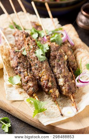 Lula Kebab From Minced Meat (beef, Lamb, Veal) On Pita Bread (lavash), Shish Kebab. With Red Onion,