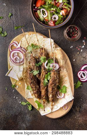 Lula Kebab From Minced Meat (beef, Lamb, Veal) On Pita Bread (lavash), Shish Kebab. With Red Onion,