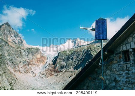 Solar Panel On Alpine Hut, High In The Mountains, Switzerland. Alternative Electricity
