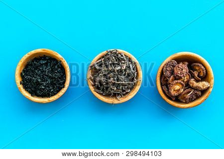 Chinese And Jupanese Food Cooking With Mushrooms, Spices, Weeds In Bowl On Blue Background Top View 