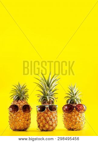 Creative Pineapple Looking Up With Sunglasses And Shell Isolated On Yellow Background, Summer Vacati