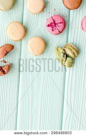 Brignt Macarons For Sweet Break On Mint Green Background Top View Mock Up