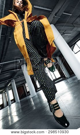 Beautiful Female In Yellow Coat