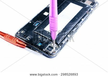 Close-up Photos Showing The Process Of Repairing A Broken Mobile Phone With A Screwdriver In The Lab