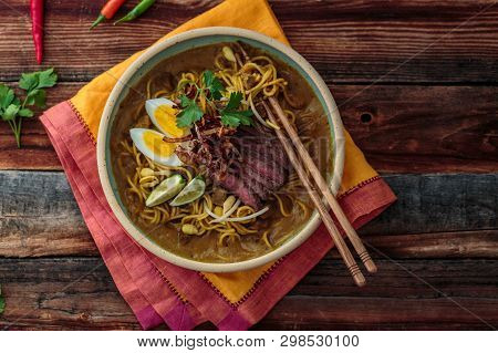 Malaysia Spicy Noodle Mee Rebus With Beef Egg And Fried Onion, Copy Space