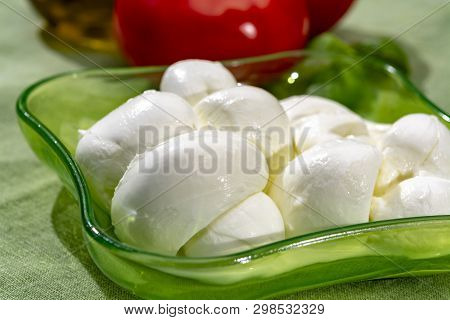 Twisted To Form A Plait Treccia Mozzarella Italian Soft Cheese Served With Fresh Basil And Tomatoes