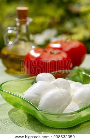 Twisted To Form A Plait Treccia Mozzarella Italian Soft Cheese Served With Fresh Basil And Tomatoes