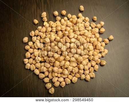 Close Up Of Dried Cheakpea Beans (cicer Arietinum) On Wooden Background. High View