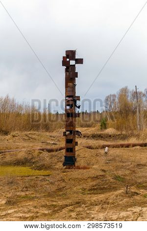 Strange Rusty Pipe Sticks Out In The Middle Of A Wasteland, Resembling A Totem Pole