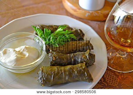 Dolma Armenian With Garlick Sauce And Greens