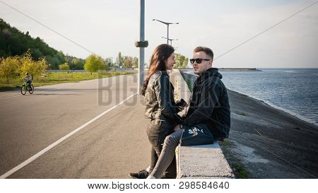 04.27.2019 - Vyshgorod, Ukraine. Happy Couple Sitting Near The Sea. Love Story