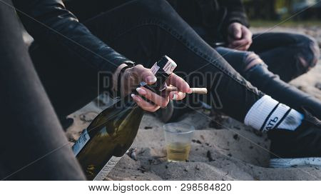 04.27.2019 - Vyshgorod, Ukraine. The Person Smoking Marijuana Joint Outdoors.