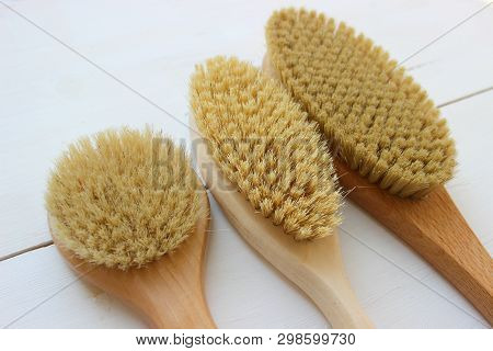 Close-up Of Wooden Massage Brush Isolated On White Background. Brush For Dry Massage. Anti-cellulite