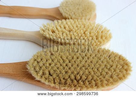 Close-up Of Wooden Massage Brush Isolated On White Background. Brush For Dry Massage. Anti-cellulite