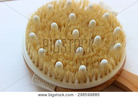 Close-up Of Wooden Massage Brush Isolated On White Background. Brush For Dry Massage. Anti-cellulite