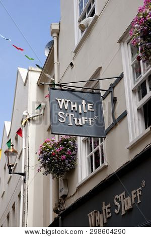 A White Stuff Shop Sign On The High Street In The Town Of St Pierre Port (st Peter Port), The Main S