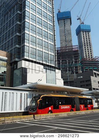 Jakarta, Indonesia - April 17, 2019: Transjakarta Bus Getting Some Passengers At Bundaran Hi Bus She