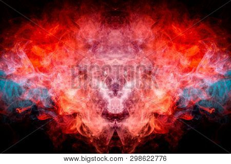 Dense Multicolored Smoke Of   Blue And Red Colors In The Form Of A Skull, Monster, Dragon On A Black