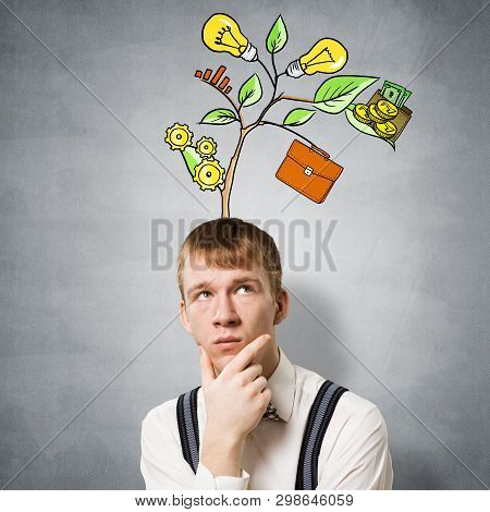 Redhead Student Looks Pensive Upwards And Thinking About Some Genius Idea. Clever Boy With Drawing I